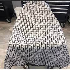 ultimate in barbering luxury with our customized barber capes. Tailor-made for style-savvy professionals
